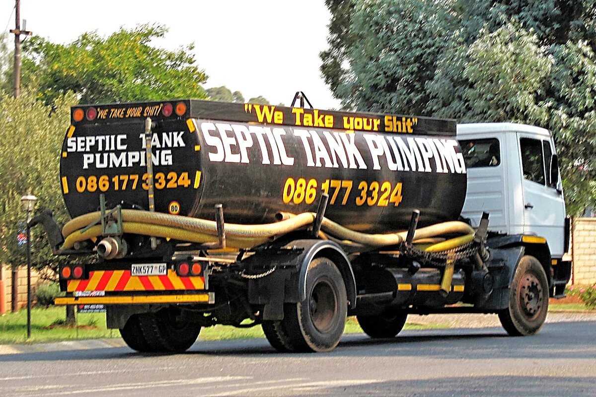 Septic pump truck positioned for scheduled pumping service
